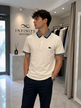 Polo Lacoste Uomo Panna con Collo e Polsini Rigati Nero/Bianco